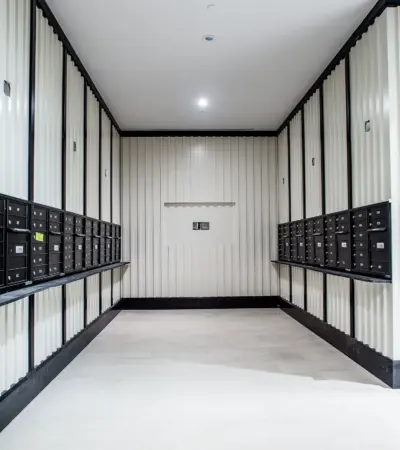 The Boerum — mail room with full wall of mailboxes
