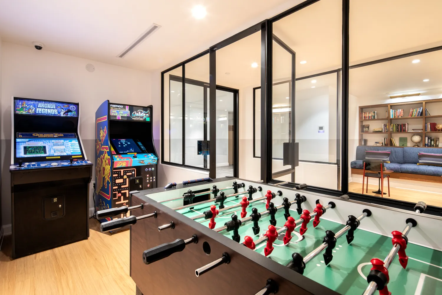 The Oriana — vintage arcade with foosball, Galaxian, and Pac-Man machines